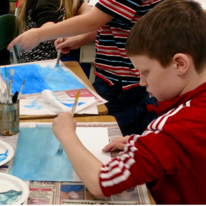 kids creating artwork with paints