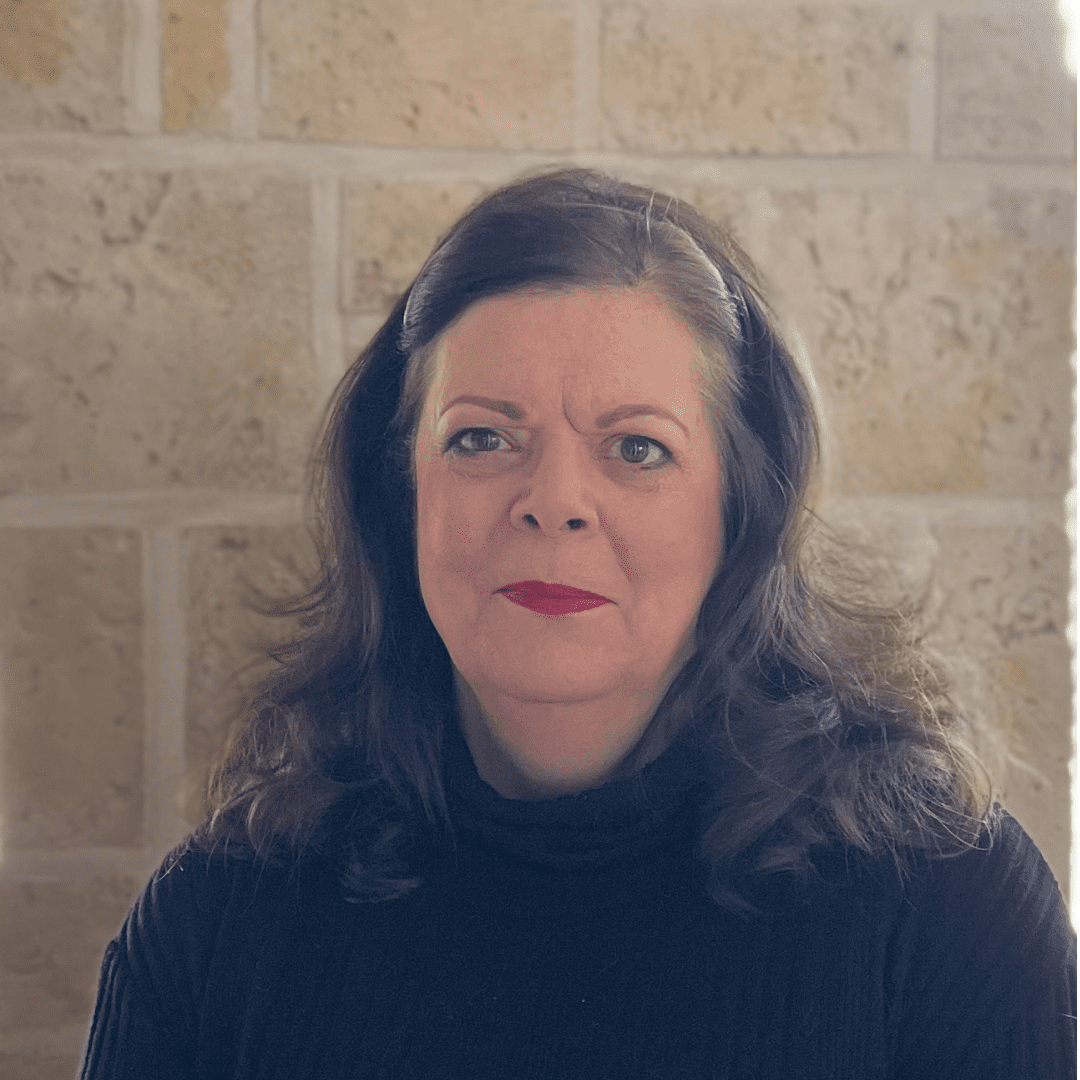 Woman with dark hair wearing black shirt.