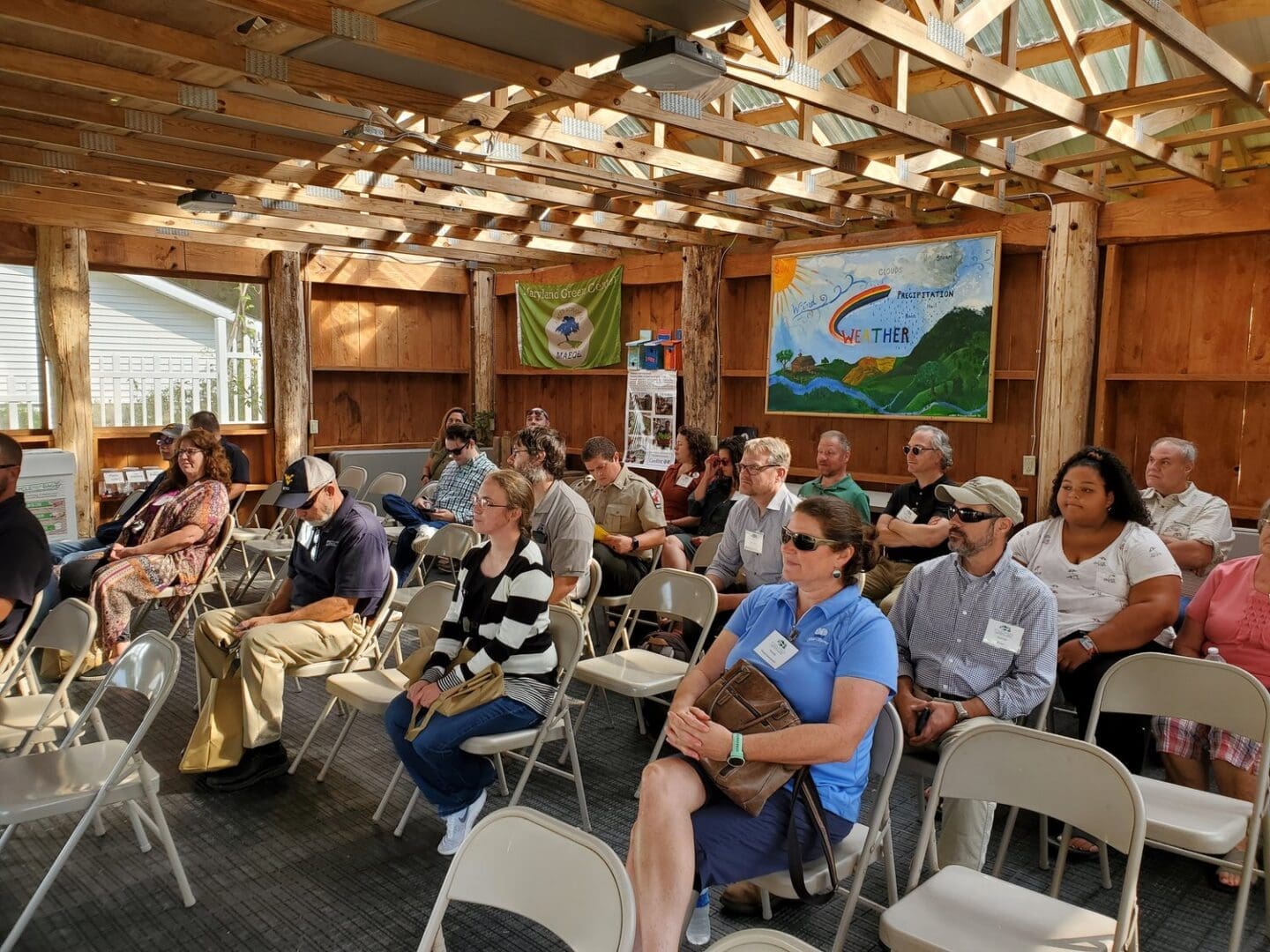 Group of people listening to a presentation.